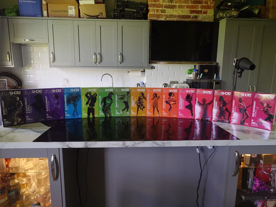 Full product range lined up on a glossy black surface