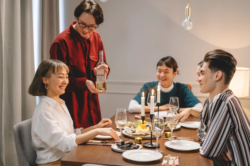 Friends talking during an evening dinner