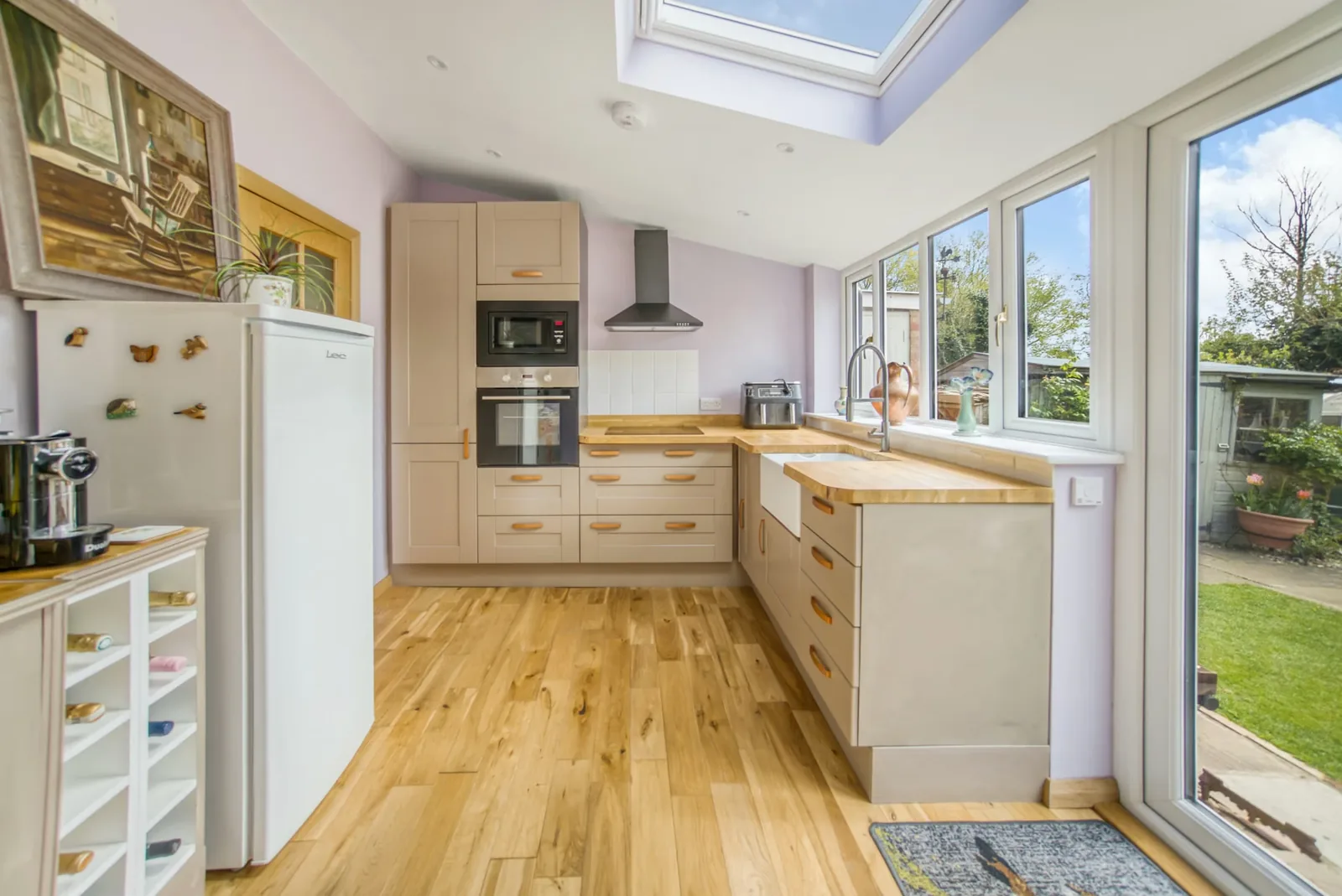 Bright kitchen with timber worktops and a rooflight in a Cavendish bungalow