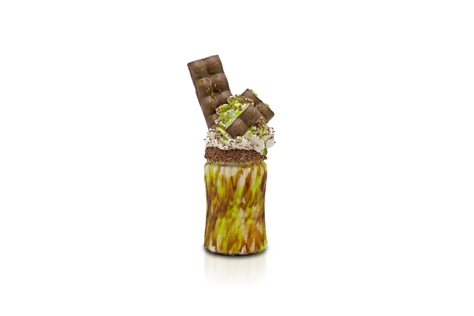 Pistachio freakshake topped with a chocolate bar