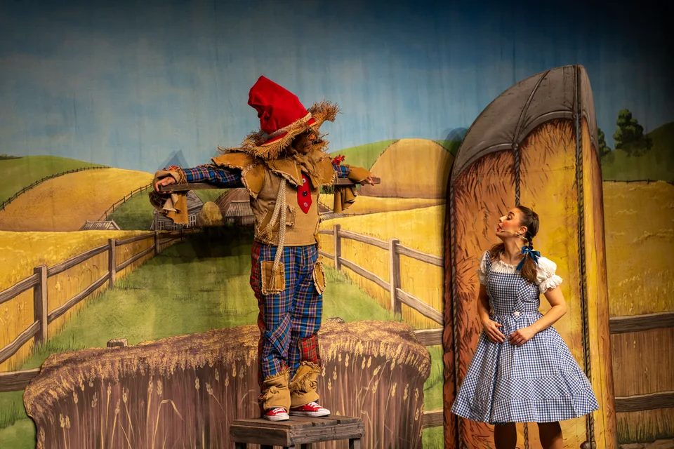 Dorothy and the Scarecrow performing in The Wizard of Oz
