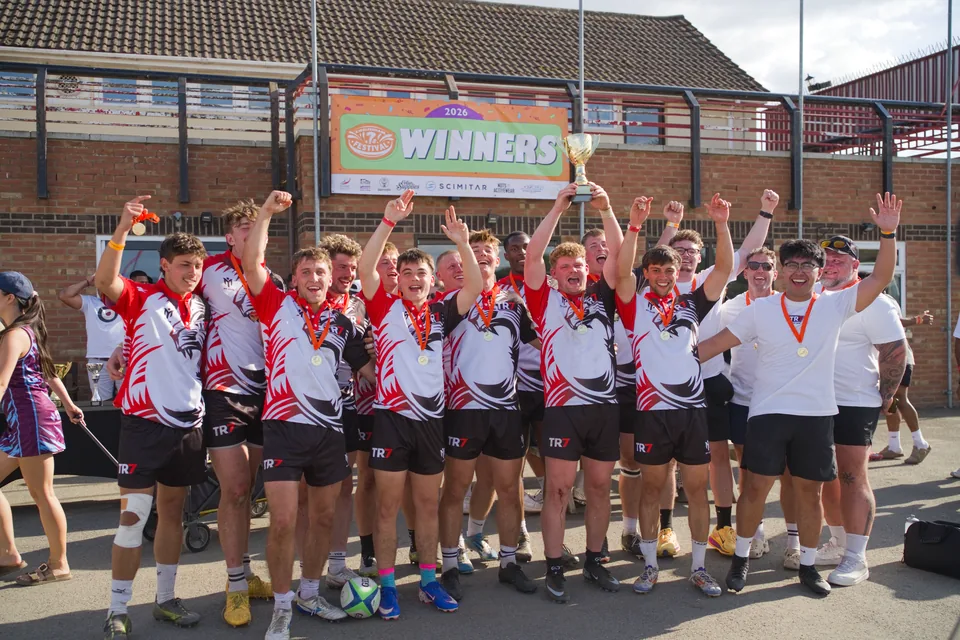 TR7 squad celebrating with a trophy