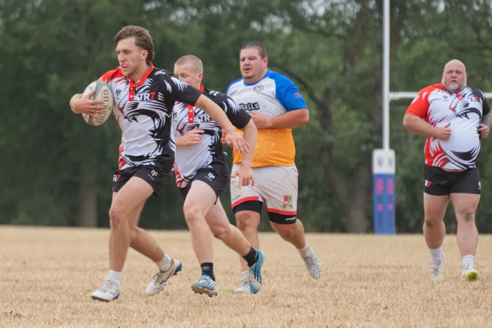 TR7 ball carrier breaking a tackle
