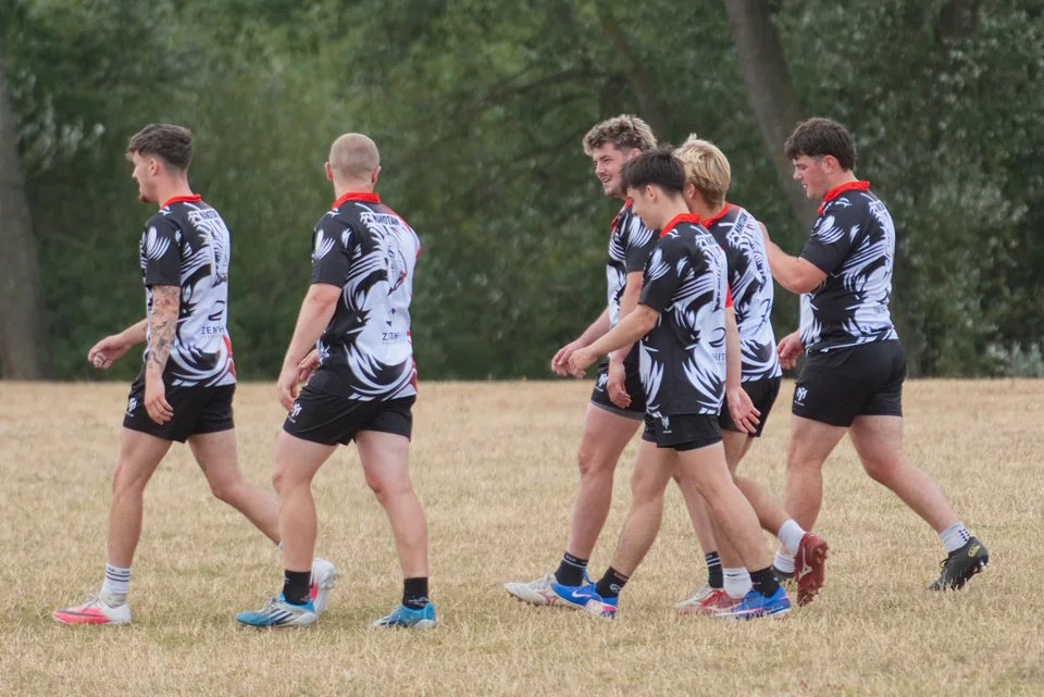 TR7 players walking together between games at Hamplified
