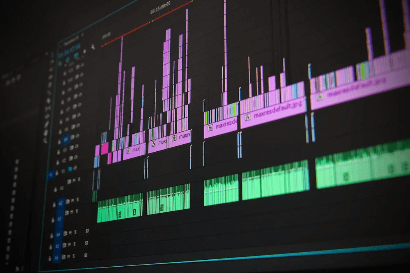 Close view of a video editing timeline with multiple picture and audio tracks