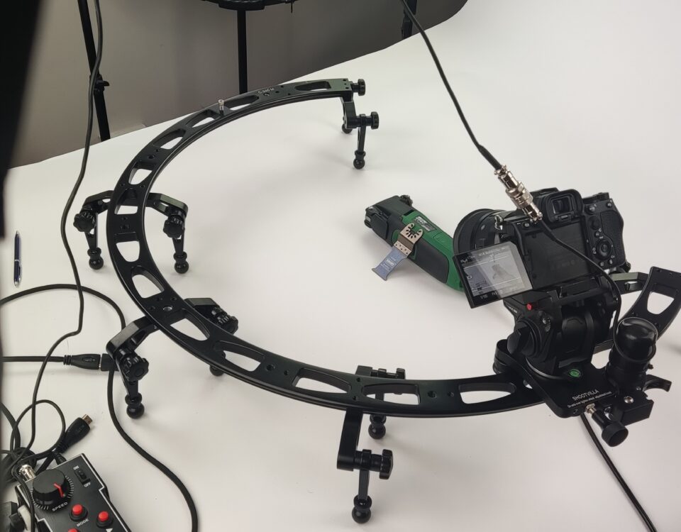 Cinema camera mounted on a curved motorised slider for a product shoot