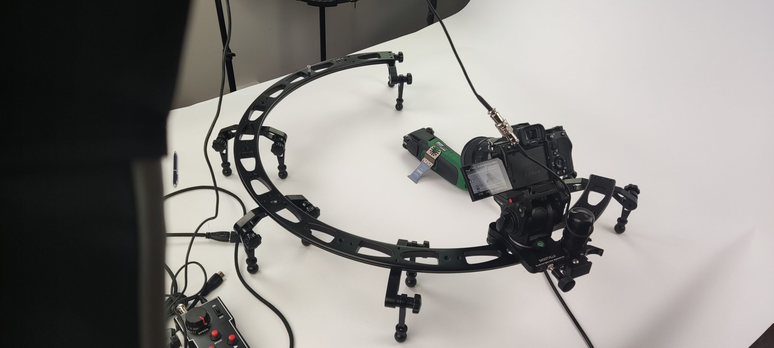 Camera on a motion-control slider during a product shoot