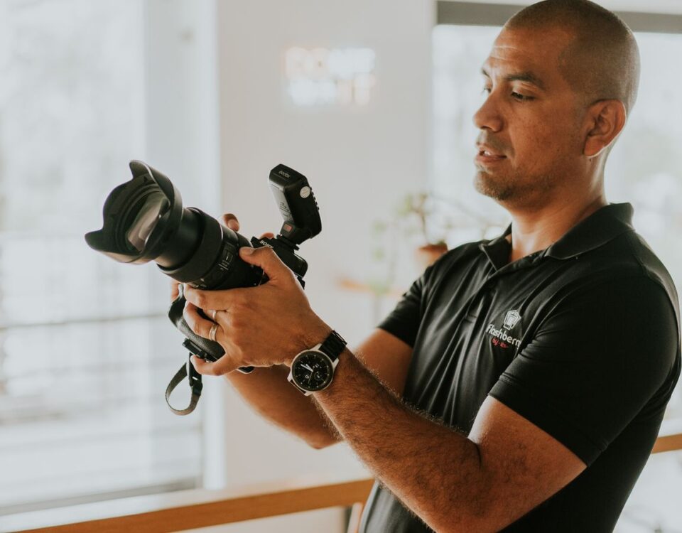 Photographer preparing a camera for a business portrait session