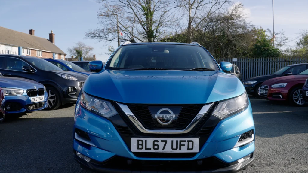 Front view of a blue Nissan Qashqai on the Target Car Supermarket forecourt