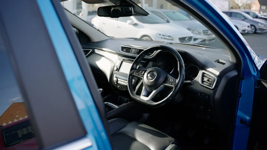 Nissan Qashqai interior filmed through the open driver door at Target Car Supermarket
