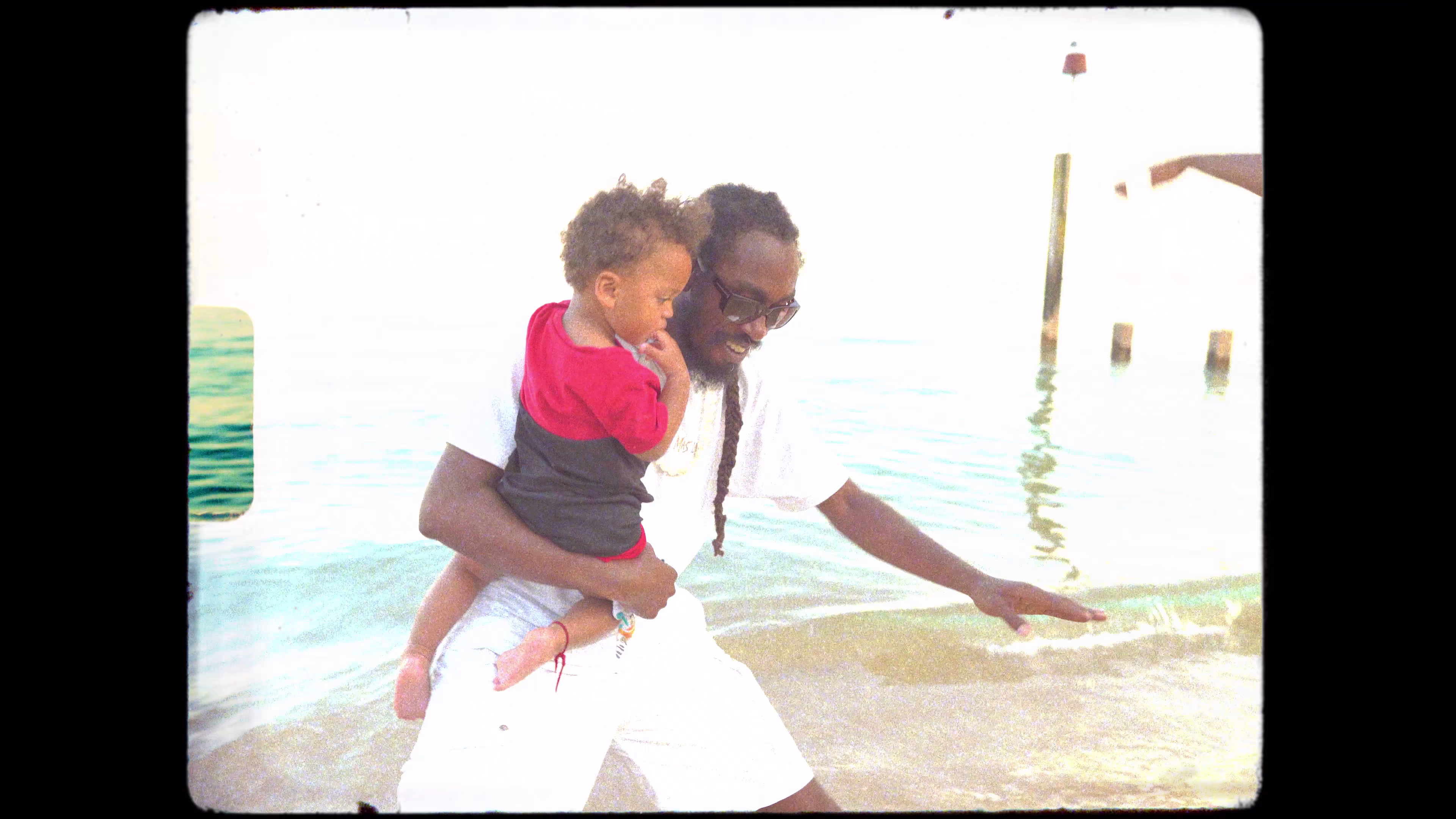 Family moment beside the sea during the music video shoot