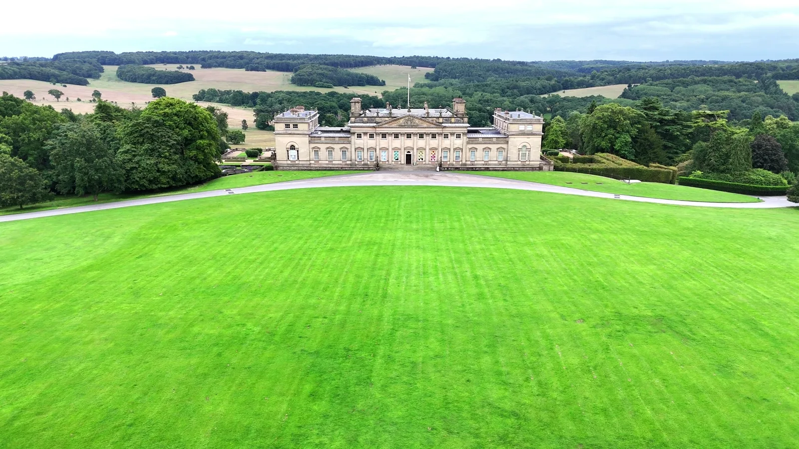 An English country estate and its surrounding grounds seen from the air