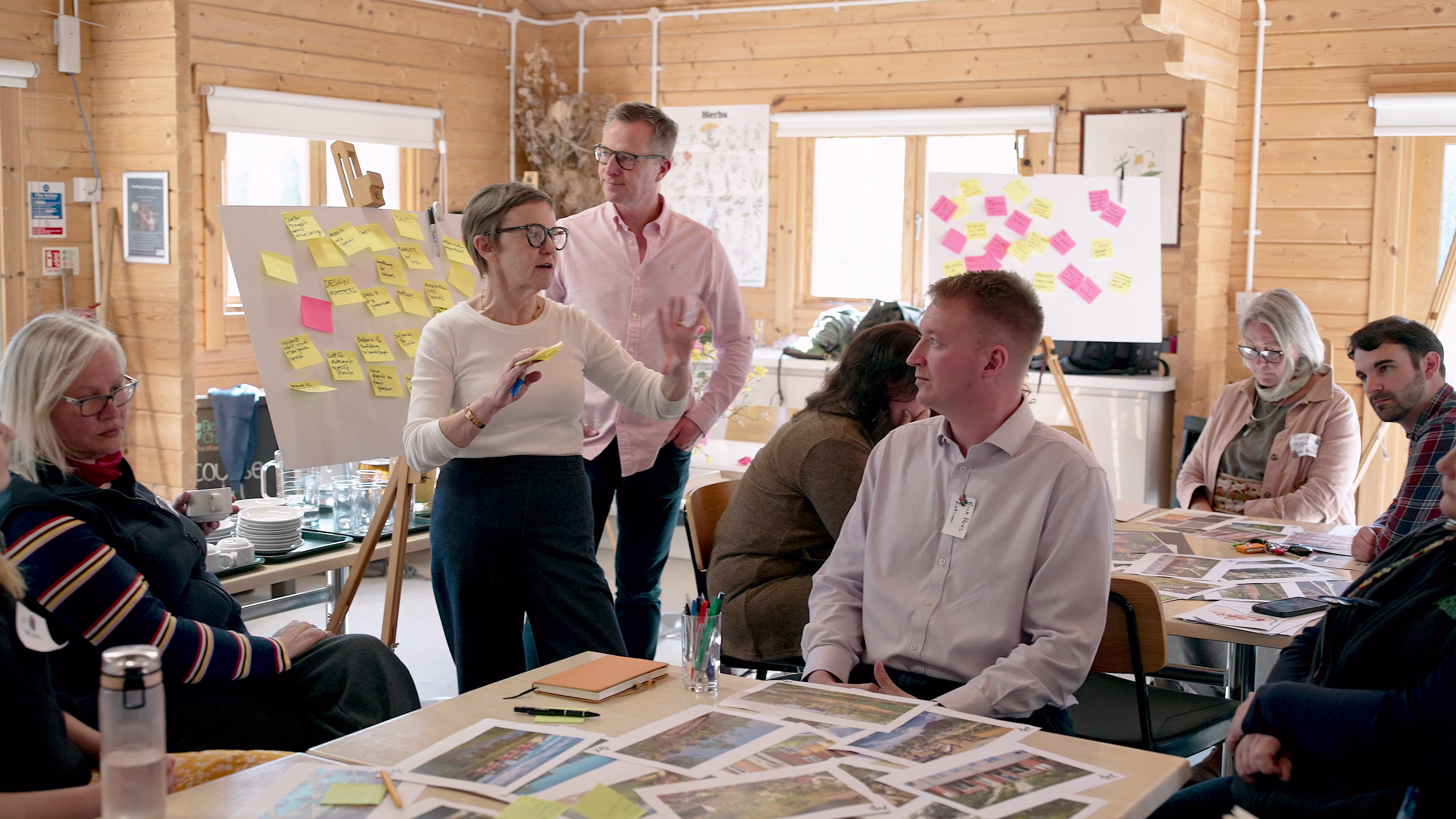 Participants exchanging ideas in the timber-lined workshop room