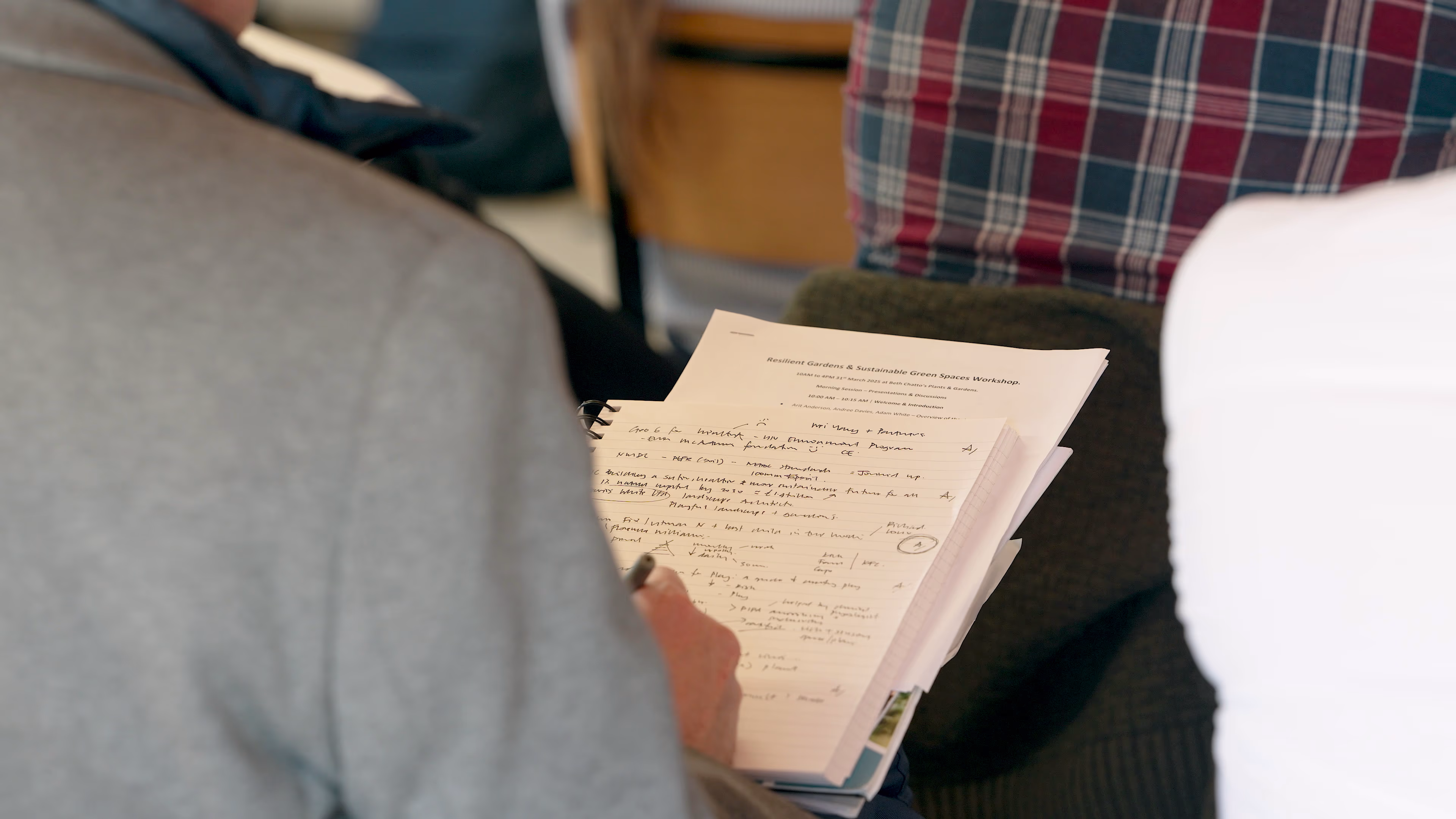 Close view of an attendee’s handwritten workshop notes