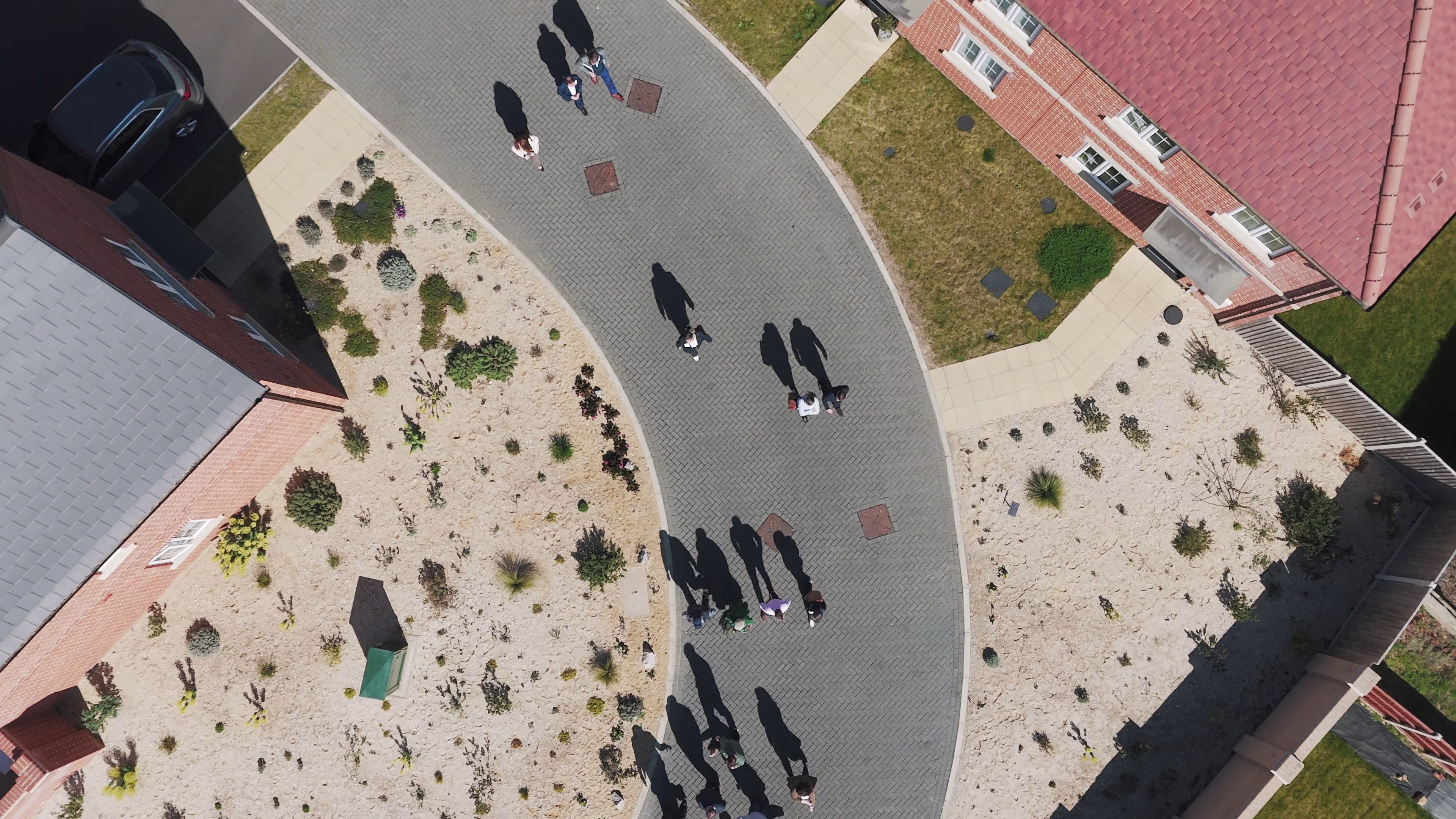 Overhead view of visitors and landscaped planting between homes at Chattowood