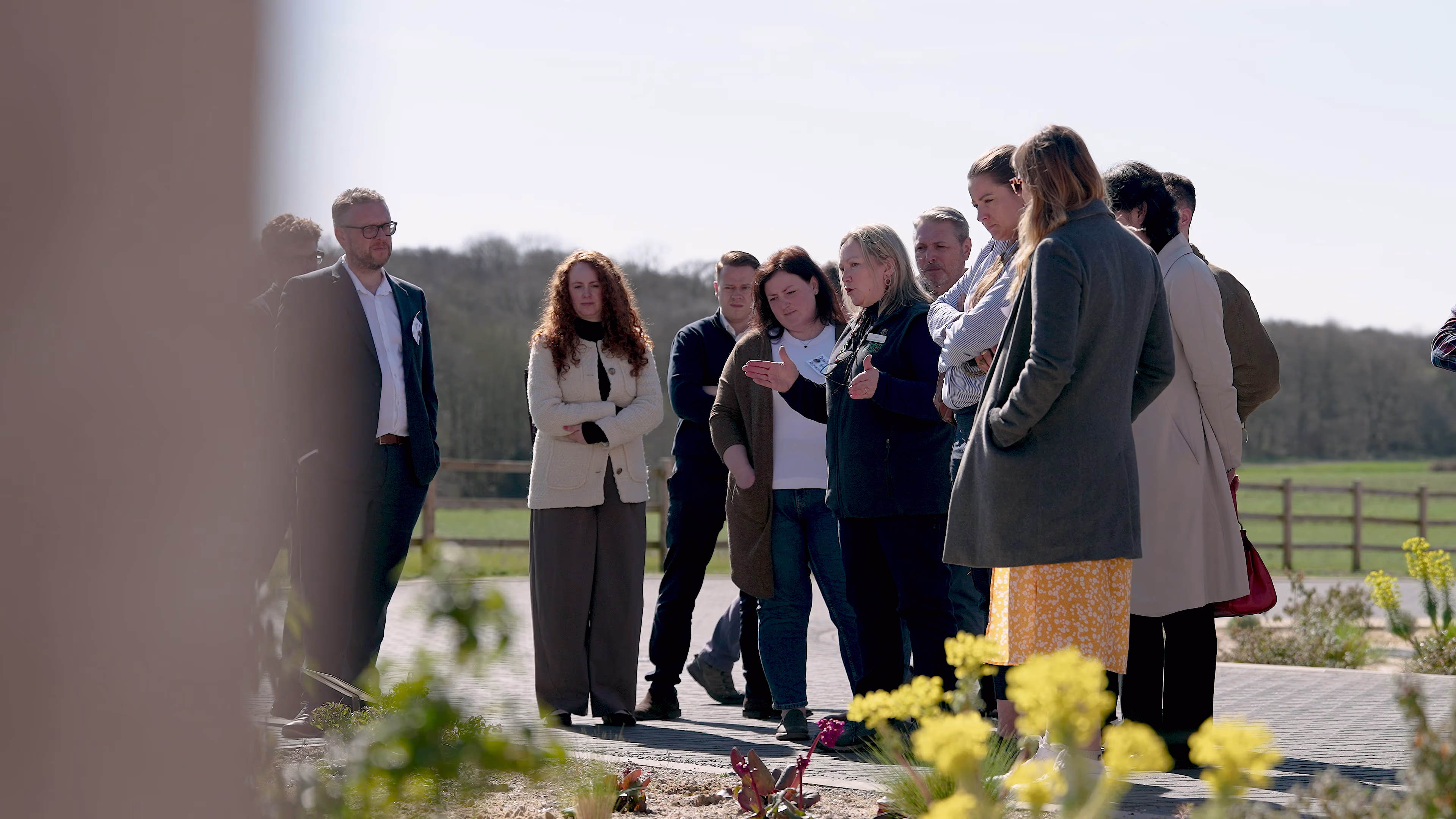 Workshop participants listening during an outdoor discussion at Chattowood