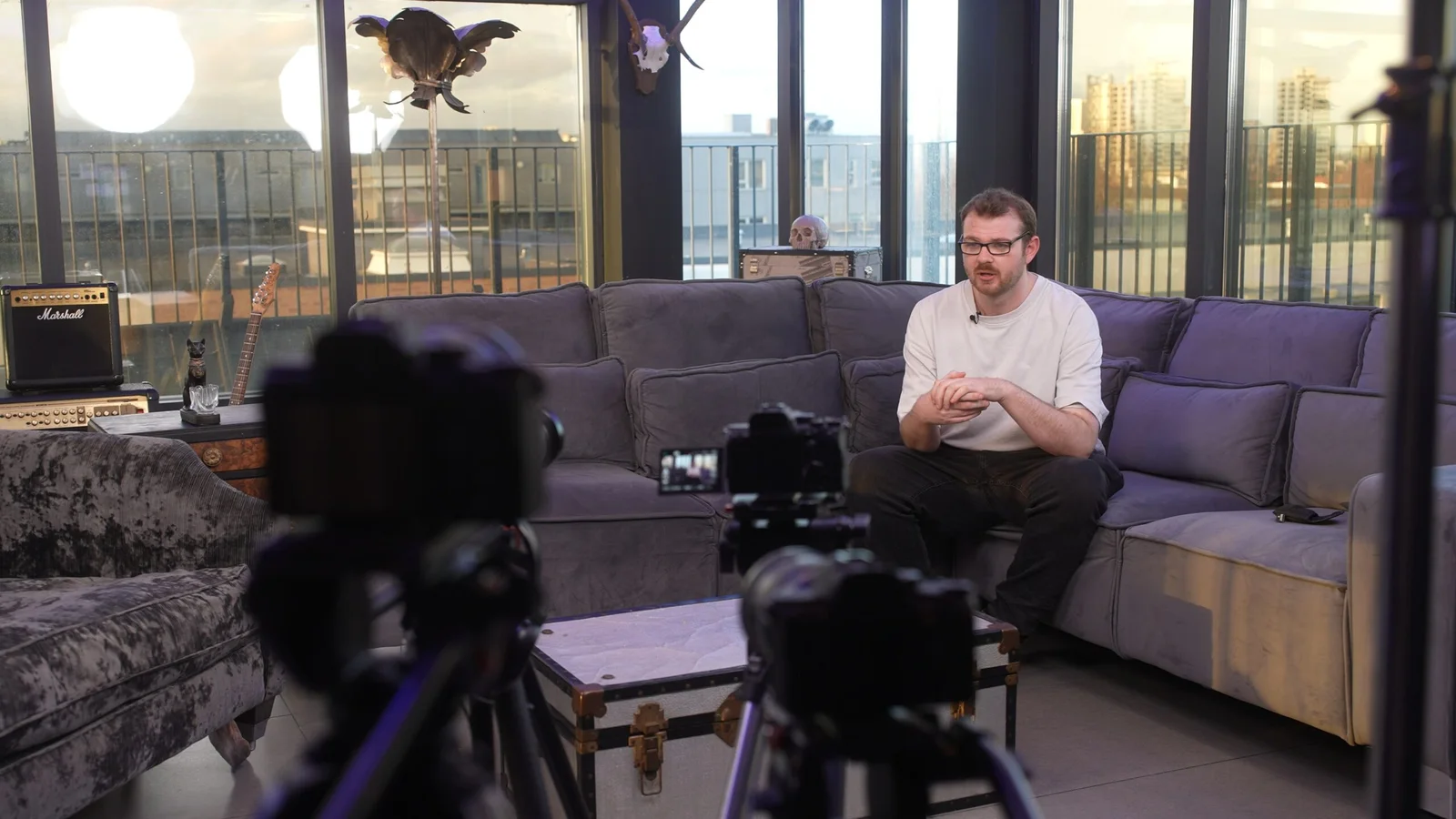 Multi-camera interview setup prepared for a seated contributor