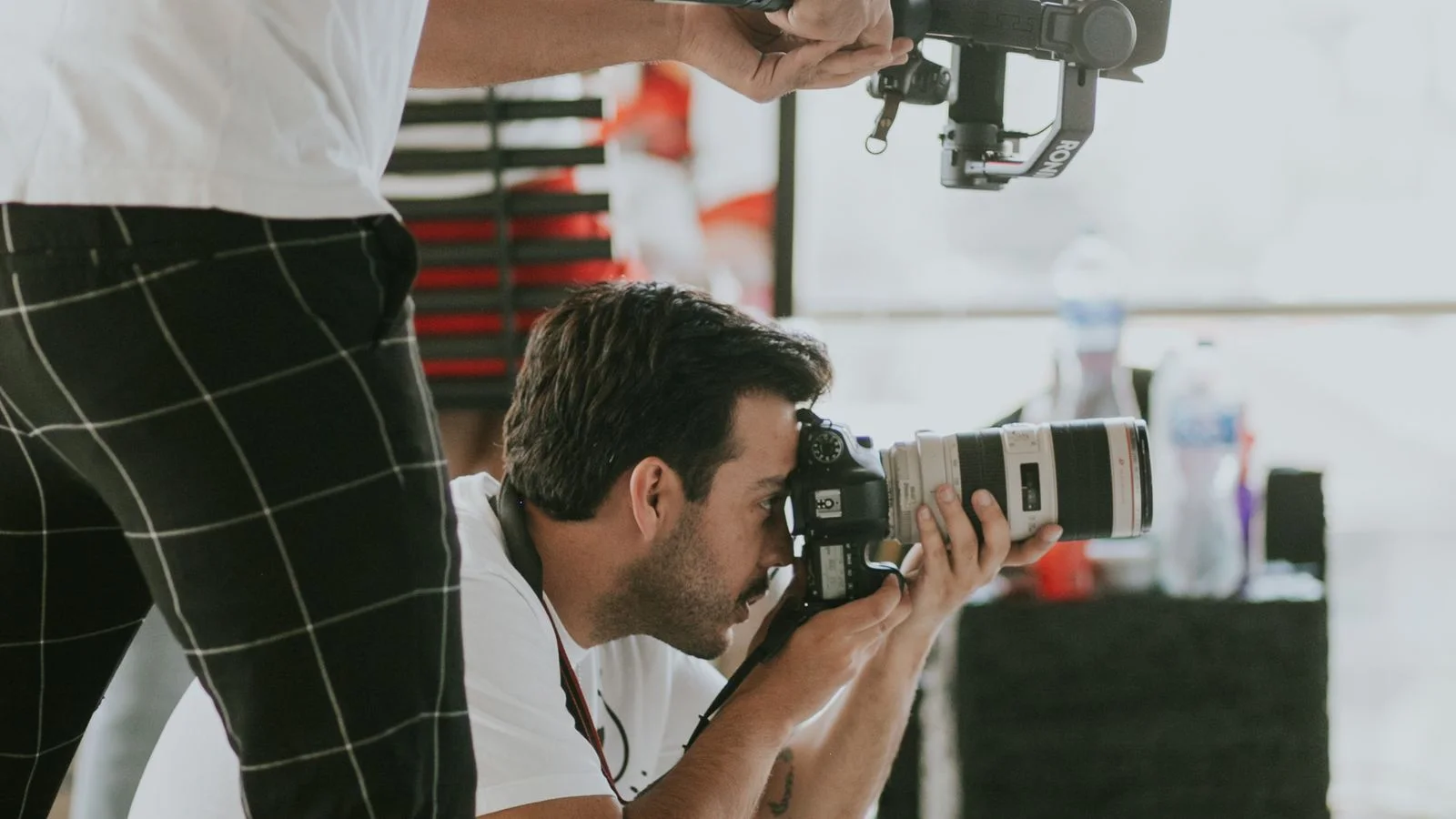 Professional photographer covering an indoor business event