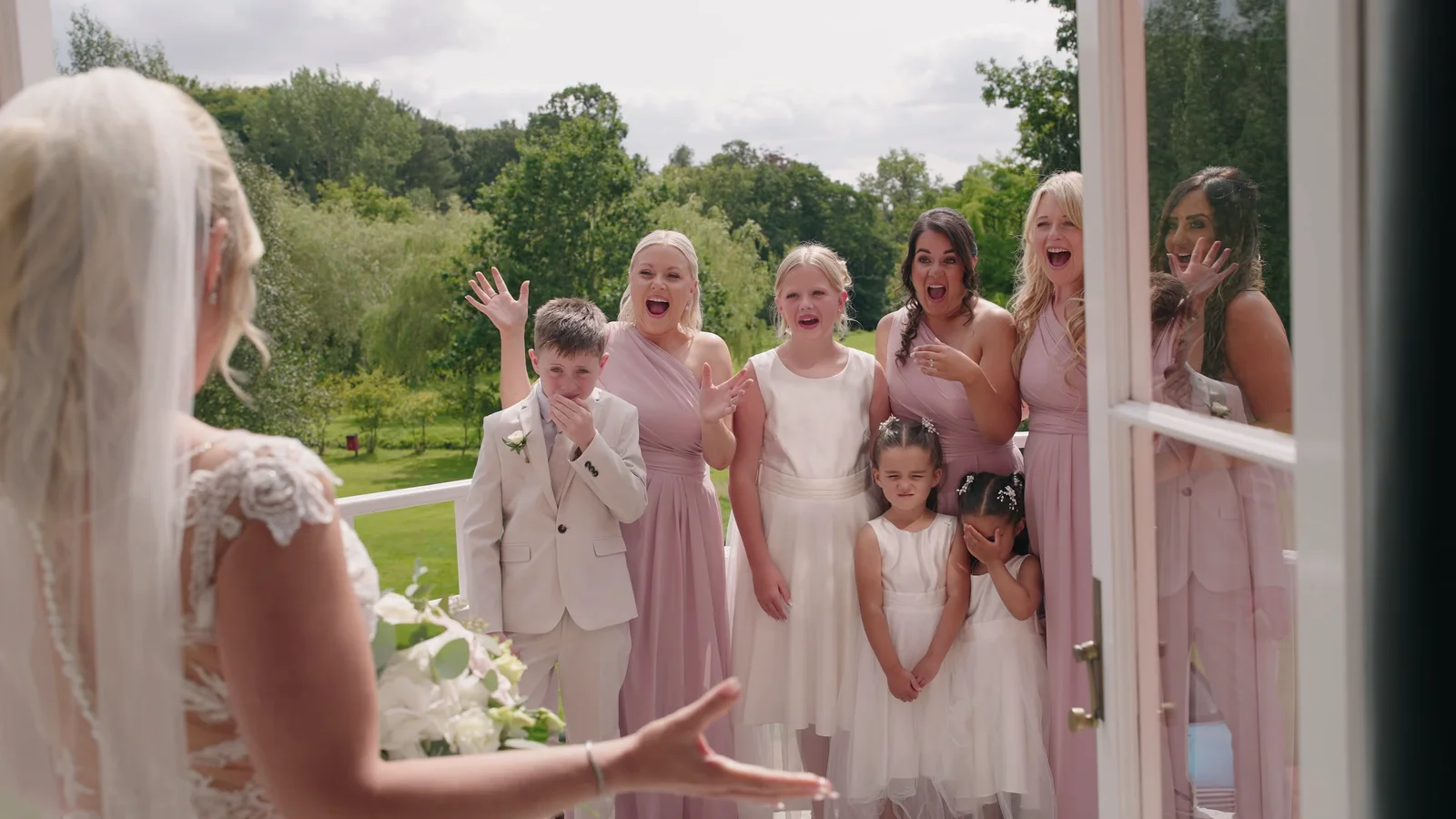 Wedding guests welcoming Jake and Lisa into the reception