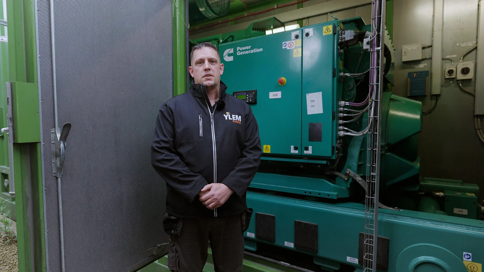 Engineer interviewed beside technical equipment