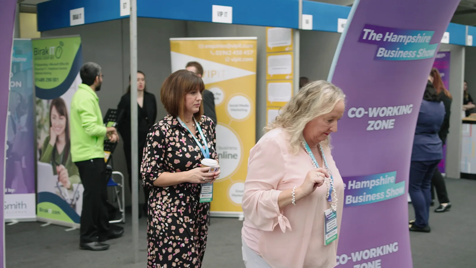 Visitors meeting in a business-show coworking zone
