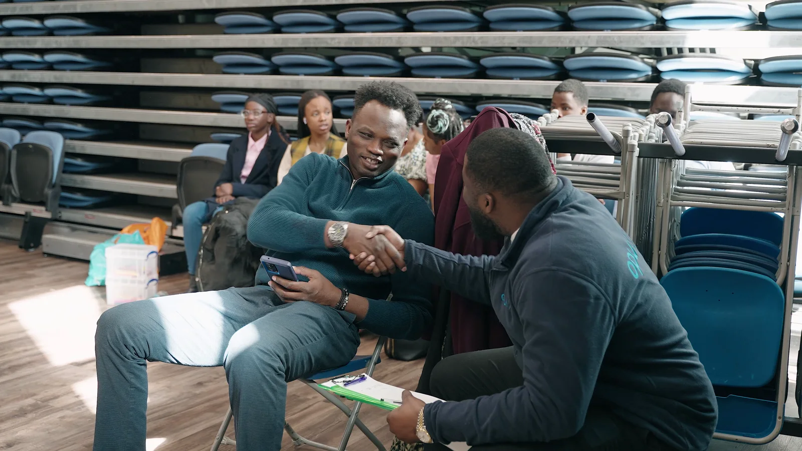 Opul Life adviser speaking with a community member
