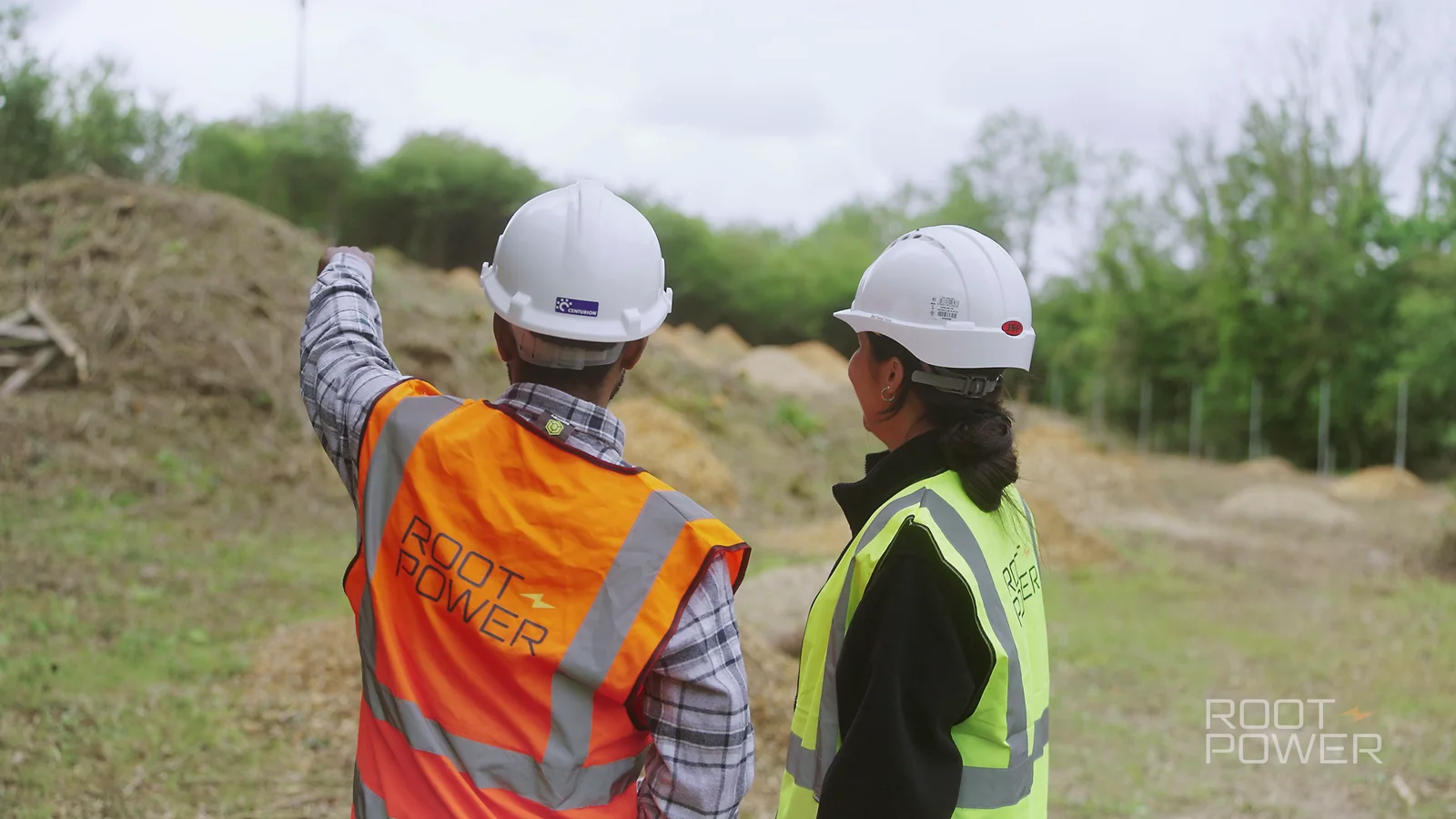 Root-Power team members discussing the Tillingdown development