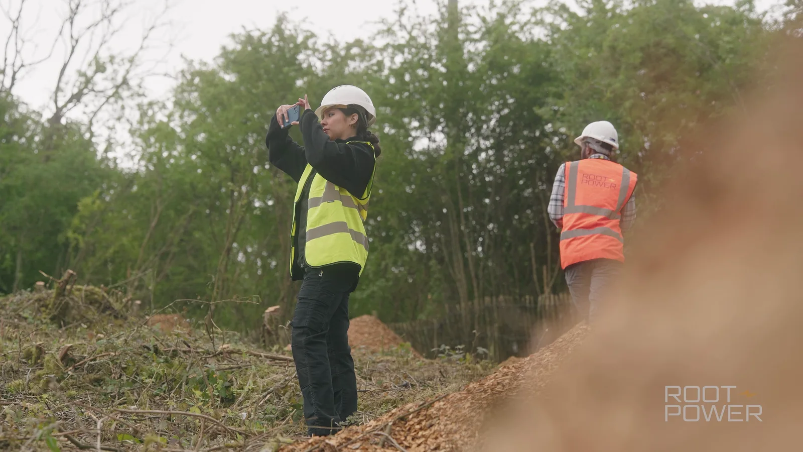 Videographer filming Root-Power team members at Tillingdown