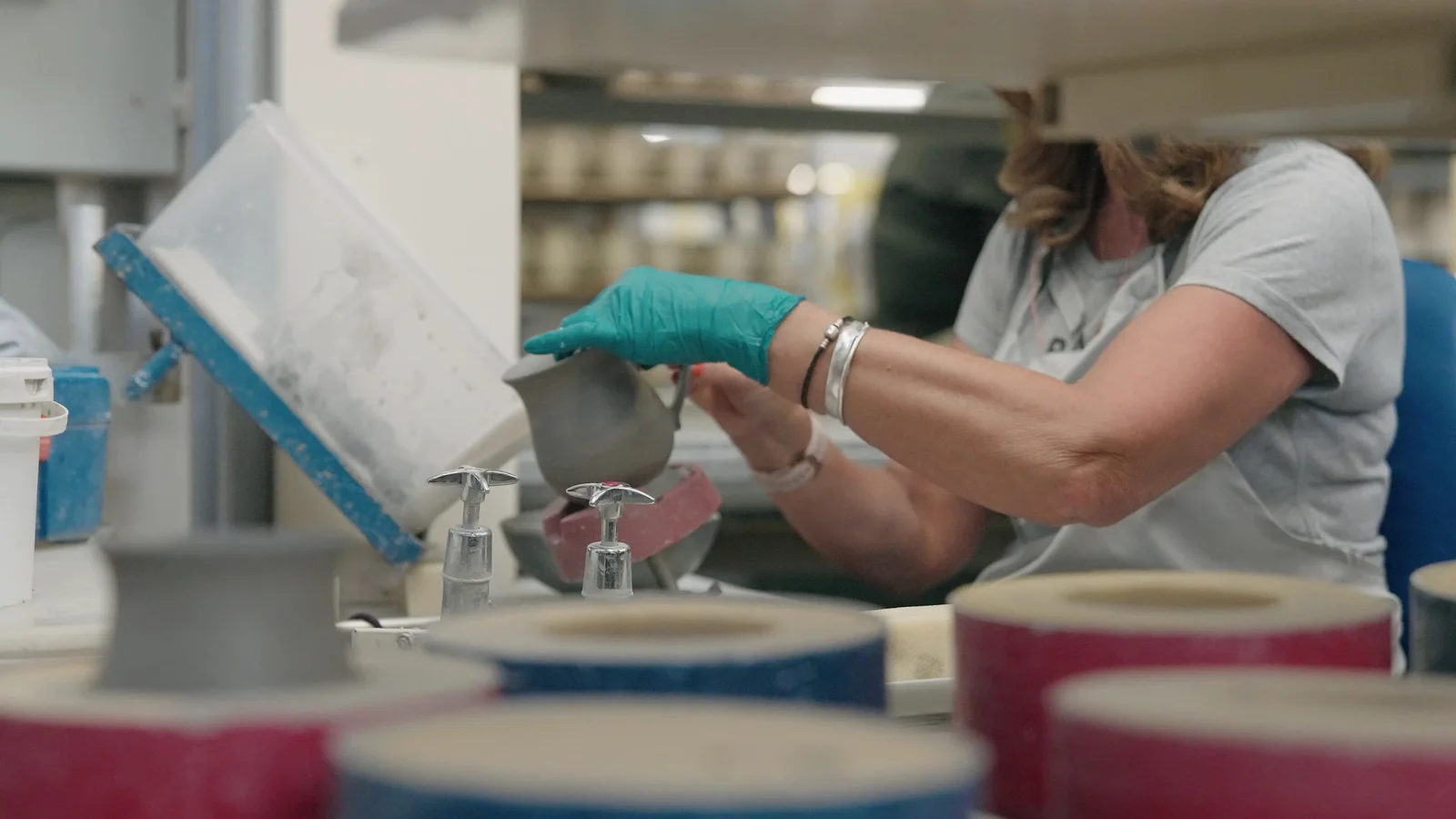 Denby craftsperson hand-finishing pottery in the factory