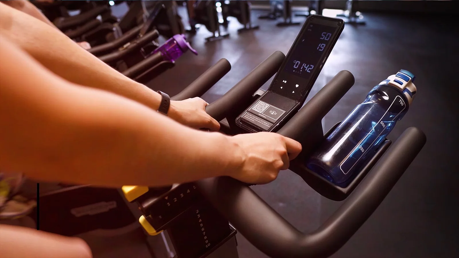 Close-up of an indoor cycling session at Essex Sport