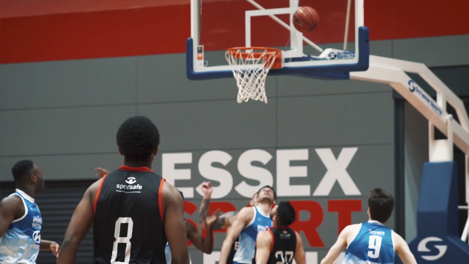 Men’s basketball action beneath the basket at Essex Sport Arena