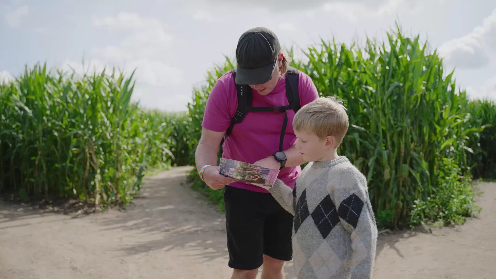 Family exploring Southwold Maize Maze during filming