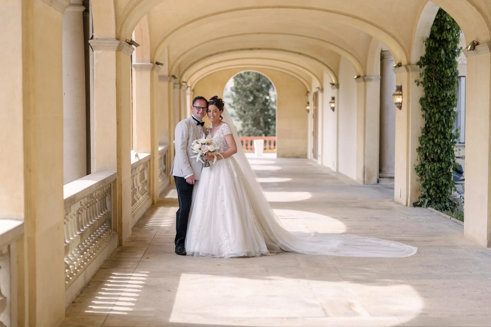 Ellie and Ernie beneath the sunlit arches at Finca Mas Solers