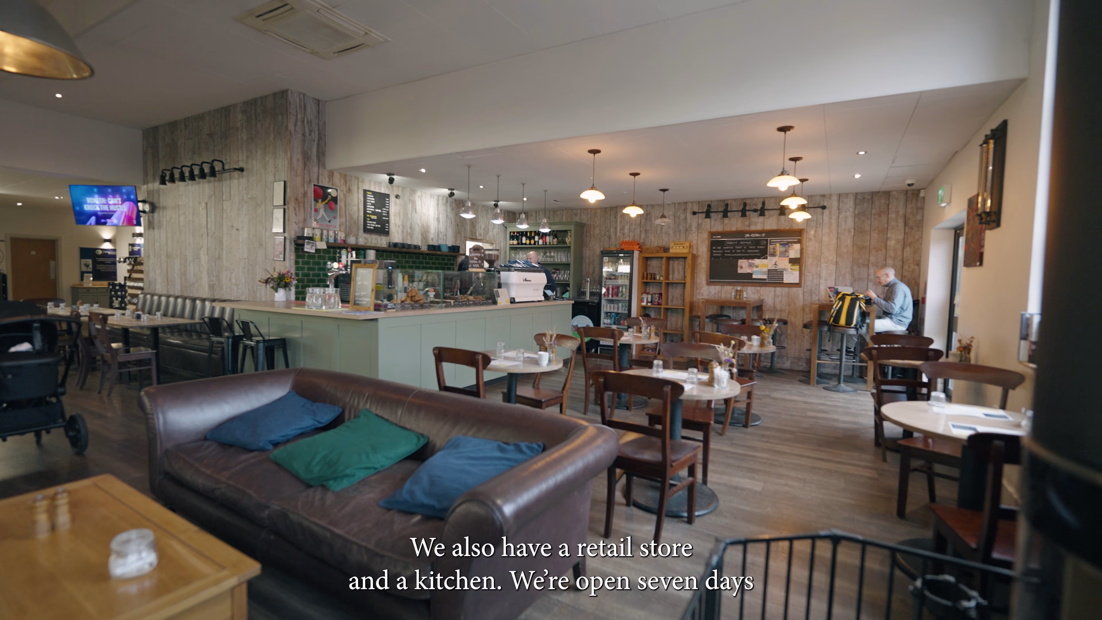 Seating and café counter inside Winchester Golf Academy