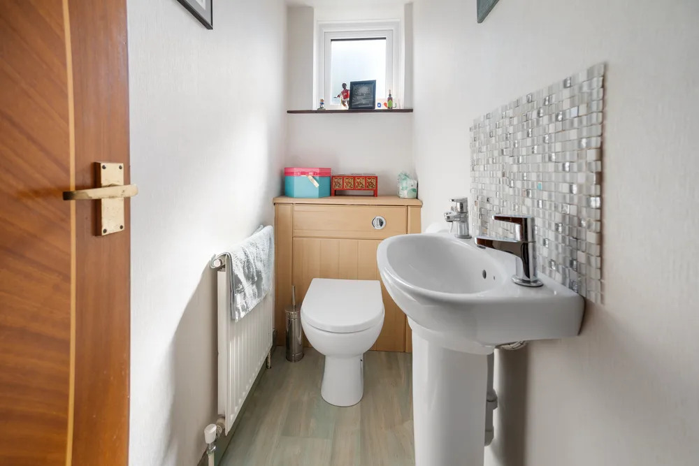 Cloakroom with basin and toilet — 13 Furness Close