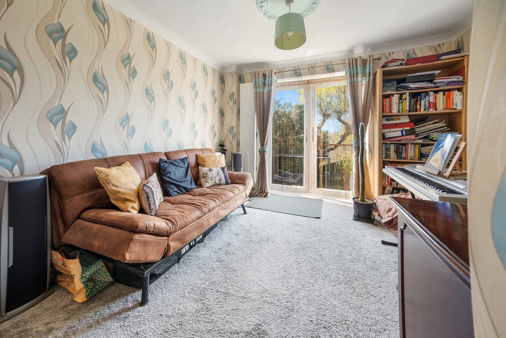 Sitting room with patterned wallpaper — 13 Furness Close