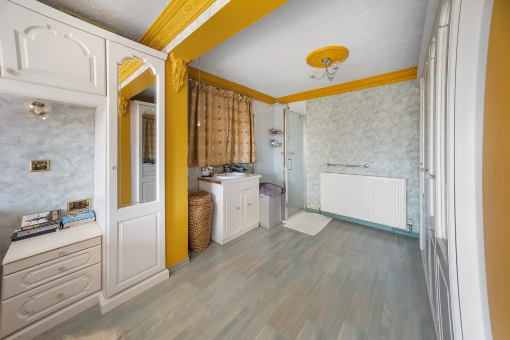 Bedroom and adjoining dressing space — 13 Furness Close
