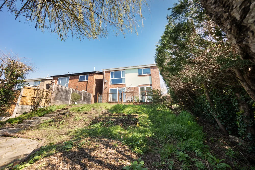 House framed by a garden tree — 13 Furness Close