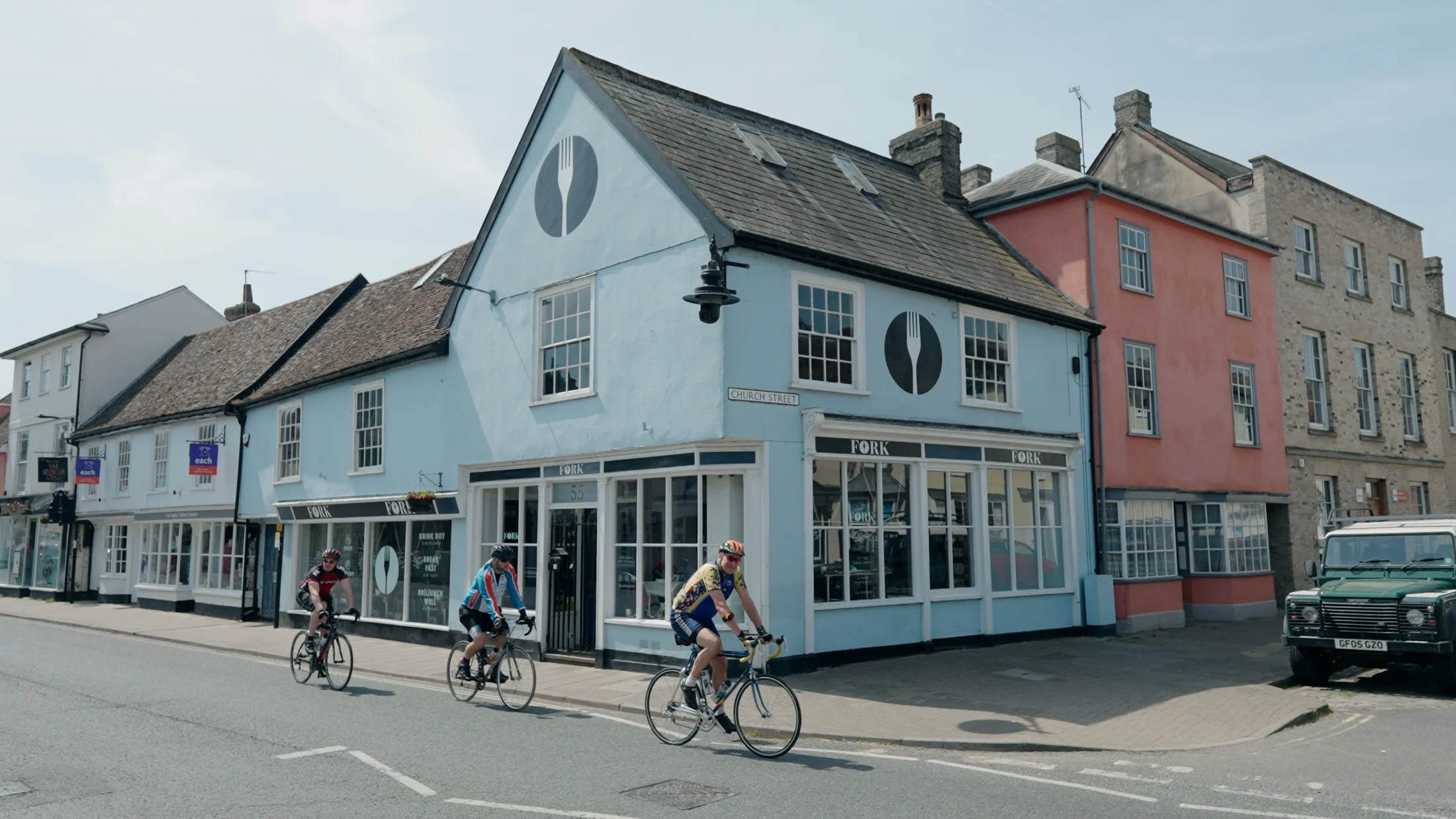 Cyclists passing the corner of Church Street in Hadleigh — film still