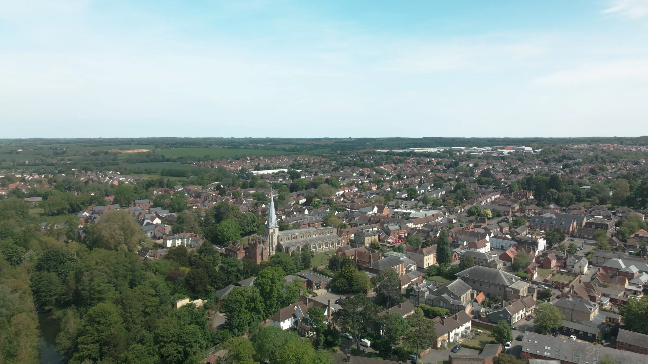 Aerial view over Hadleigh town centre and countryside — film still