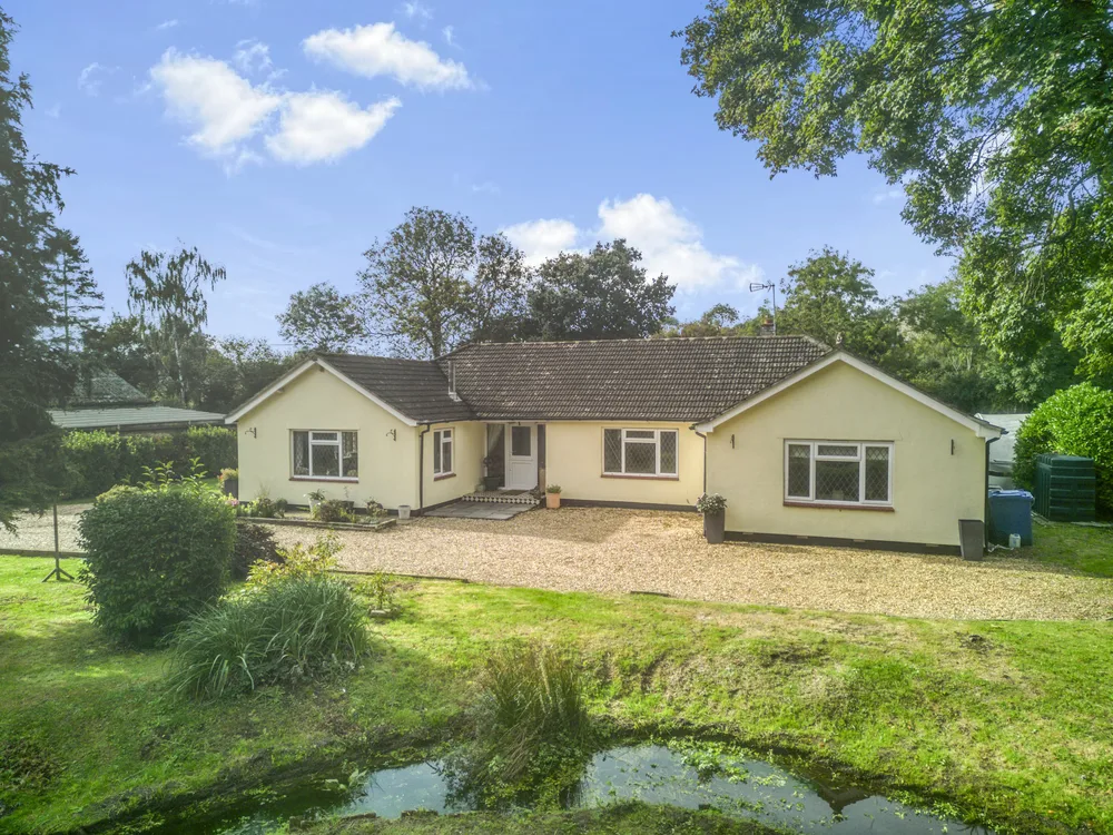 Bungalow beside a garden pond — Vancouver, Brockley