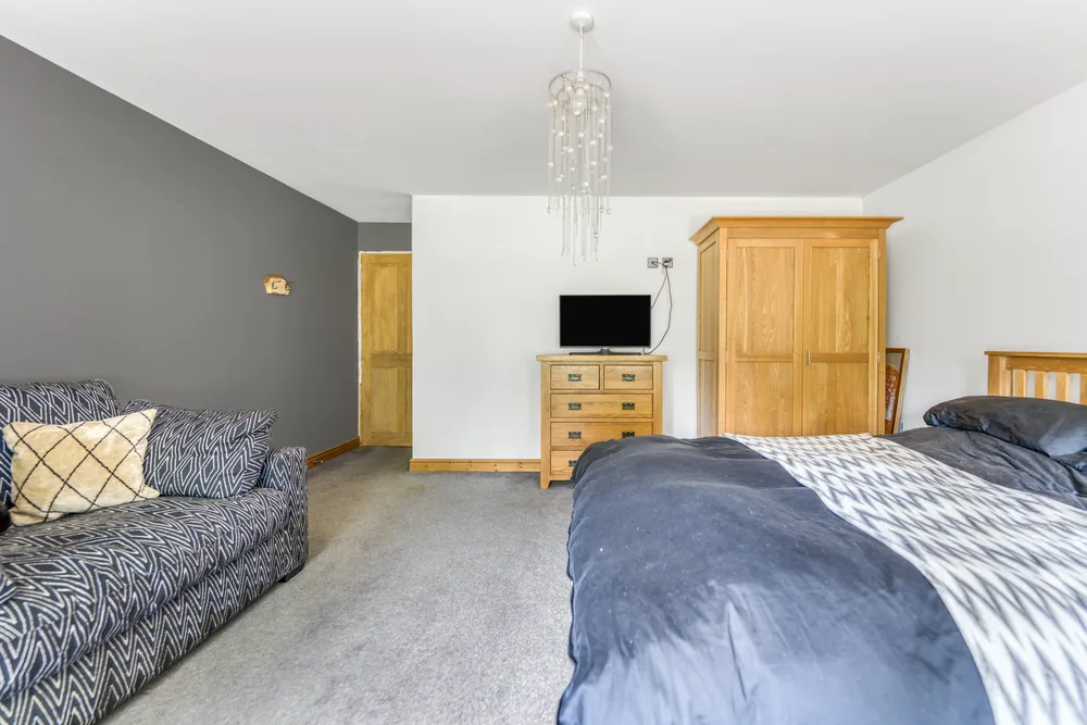 Bedroom with wardrobe and dark bedding — Vancouver, Brockley