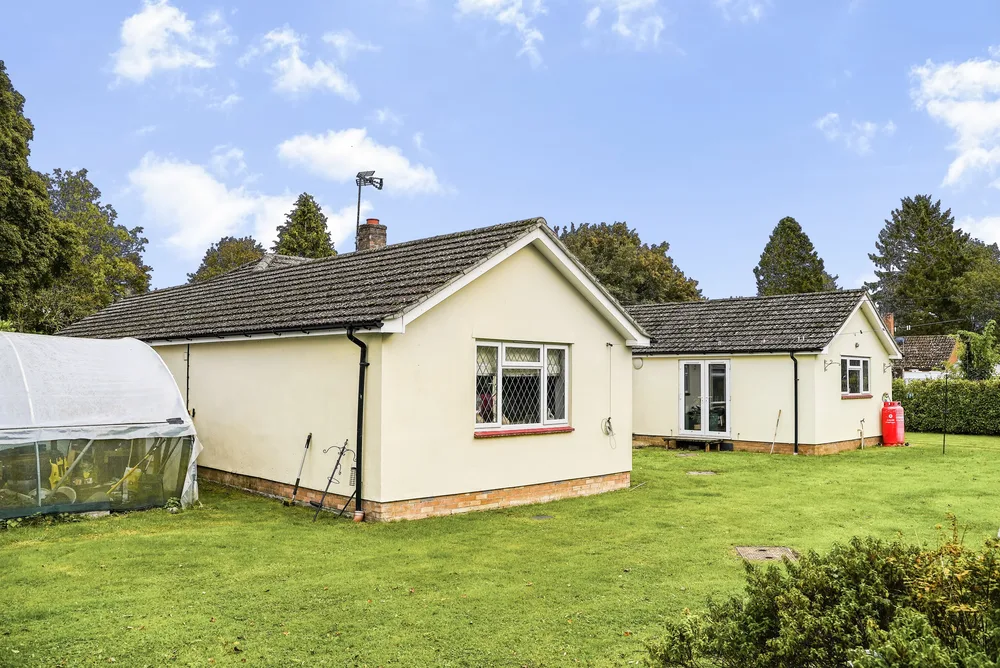 Bungalow with trees beyond — Vancouver, Brockley