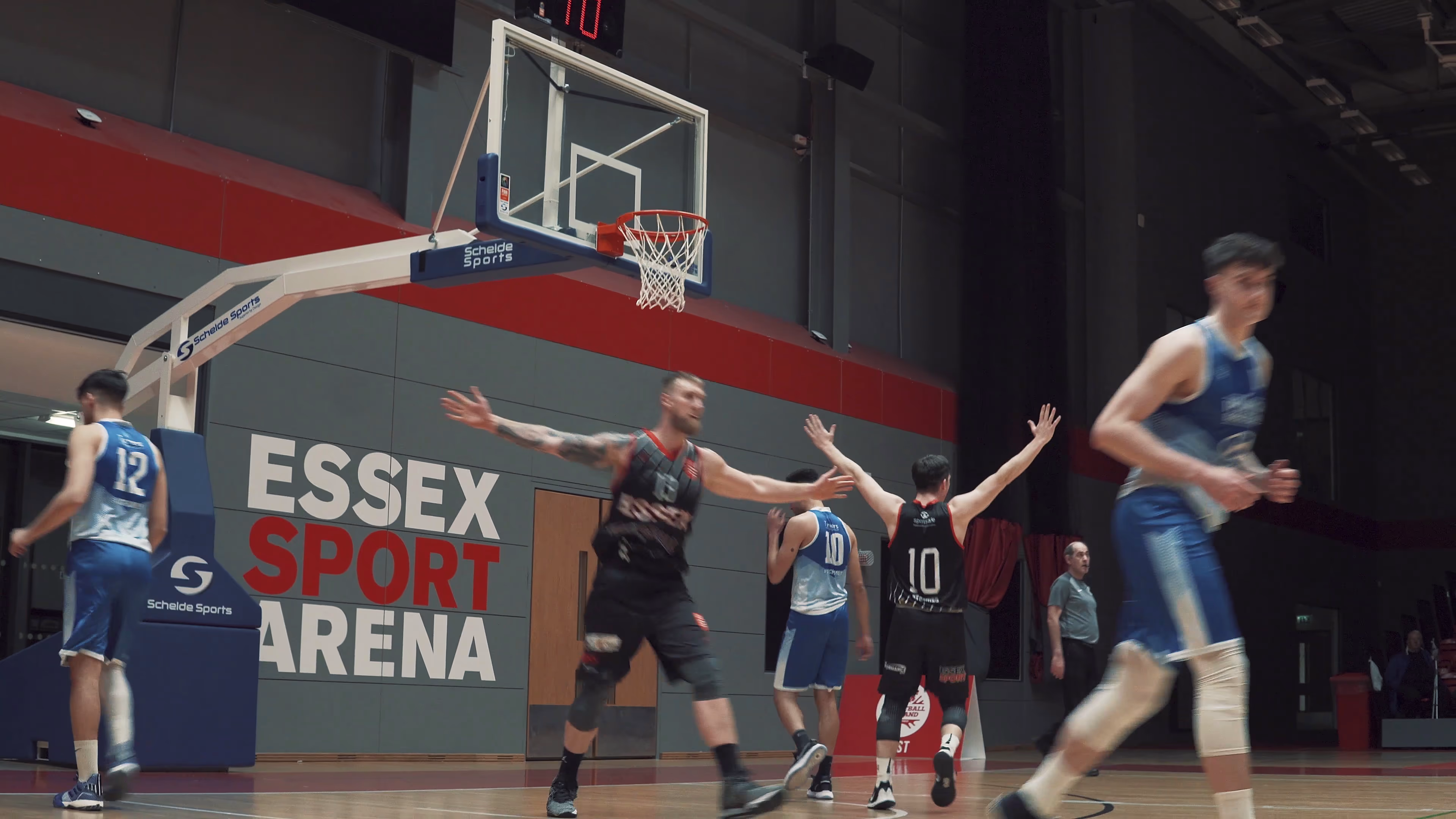Players following the action on the Essex Sport Arena court