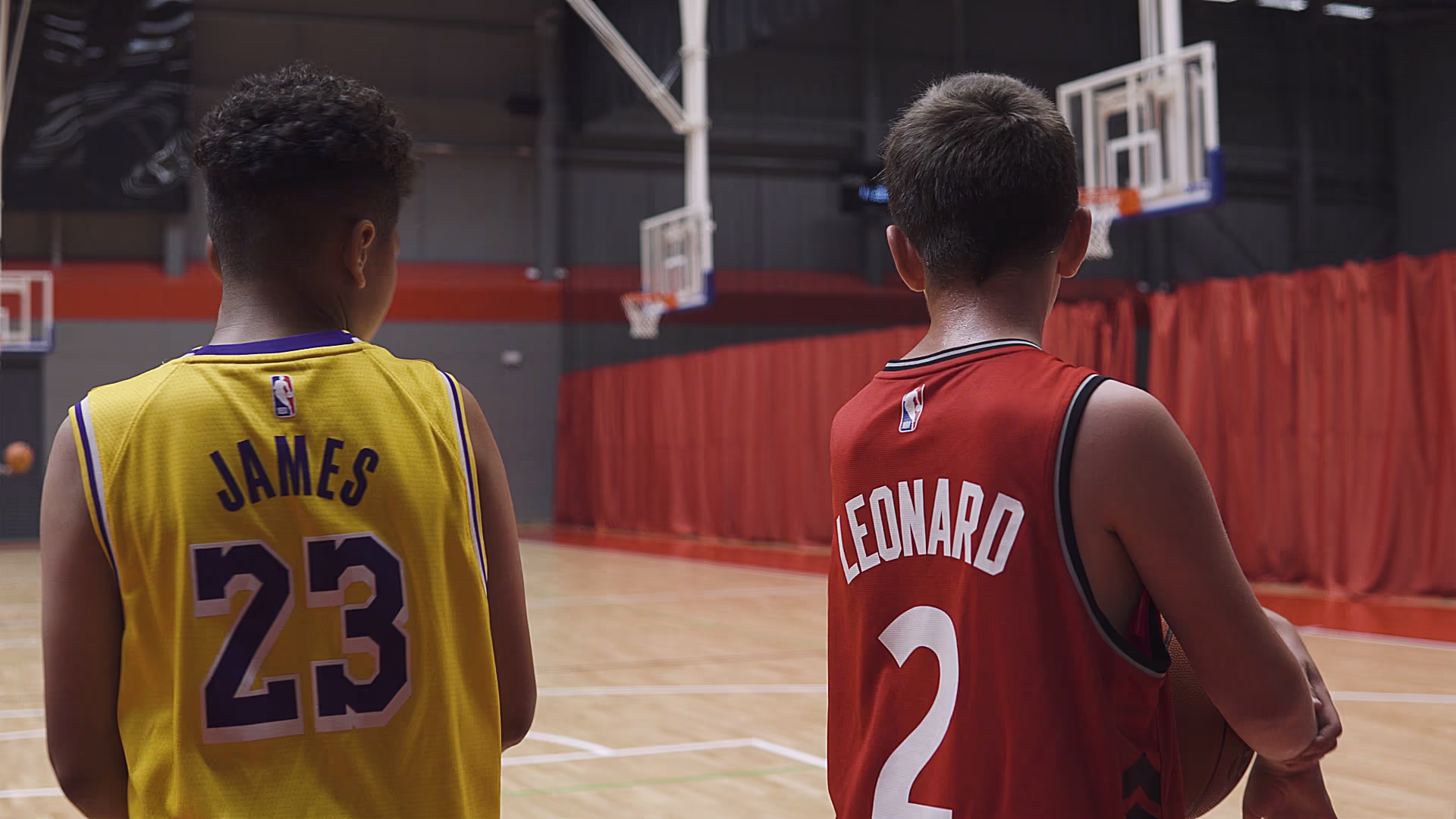 Basketball players looking across the Essex Sport Arena court