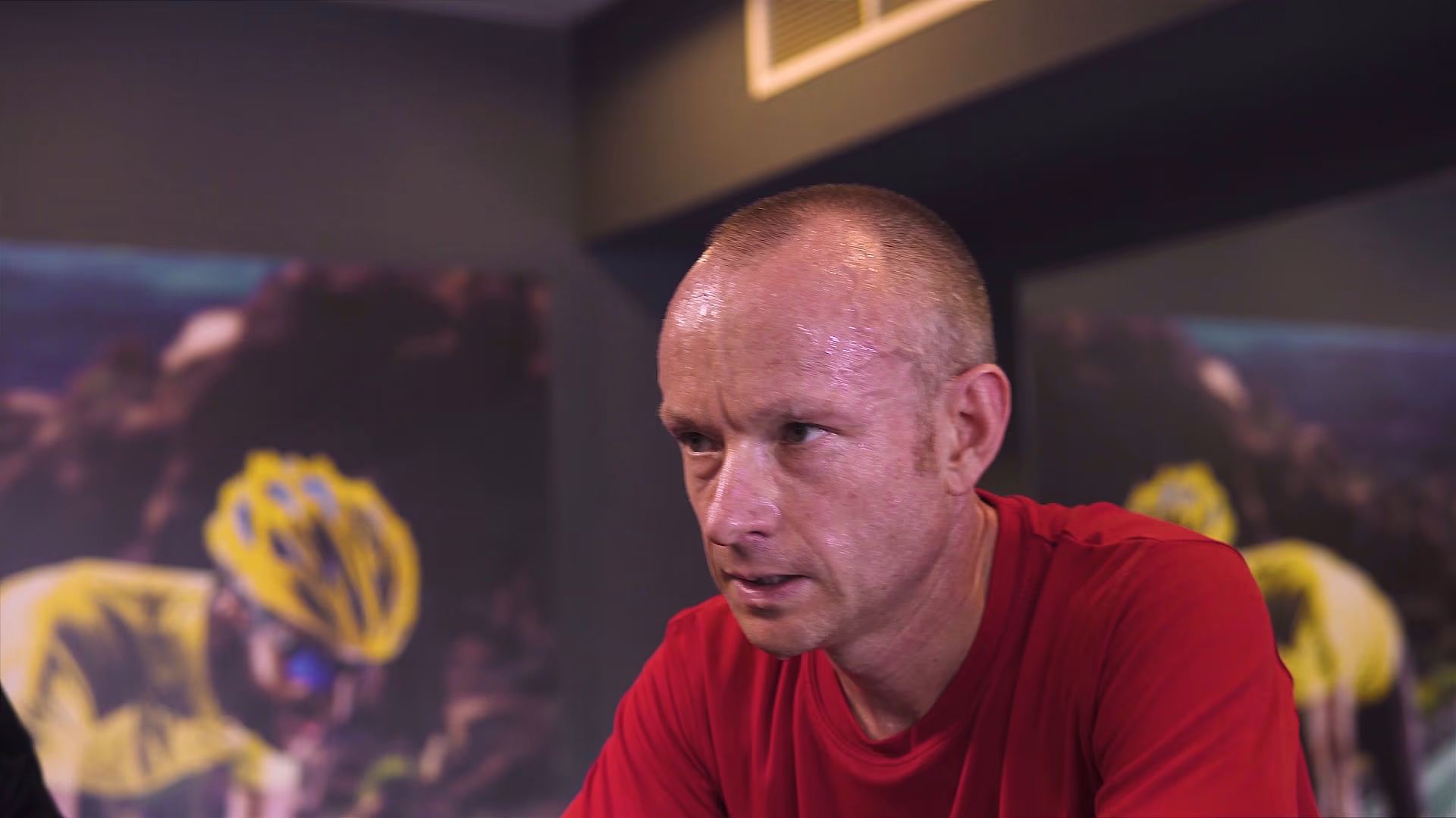 Participant concentrating during an indoor cycling class