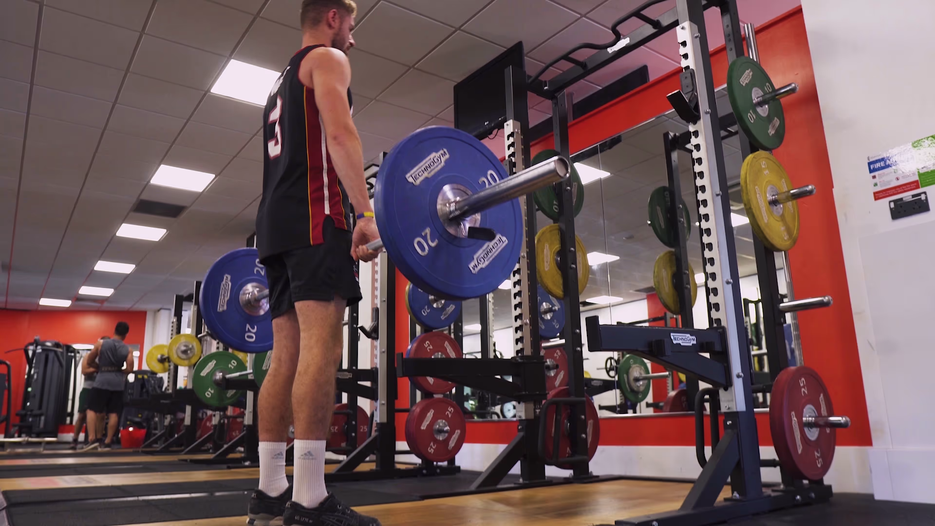 Weight training at a rack in the Essex Sport gym