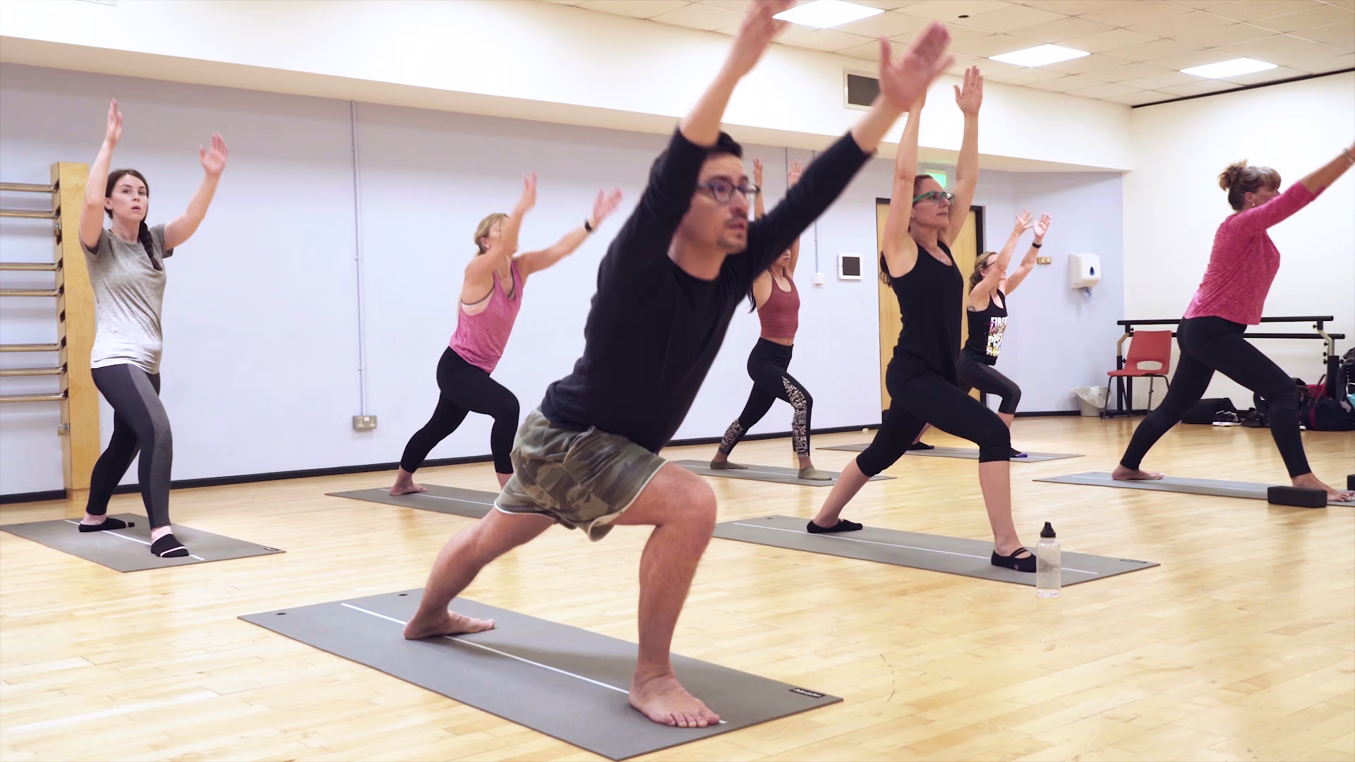 Essex Sport yoga participants stretching together