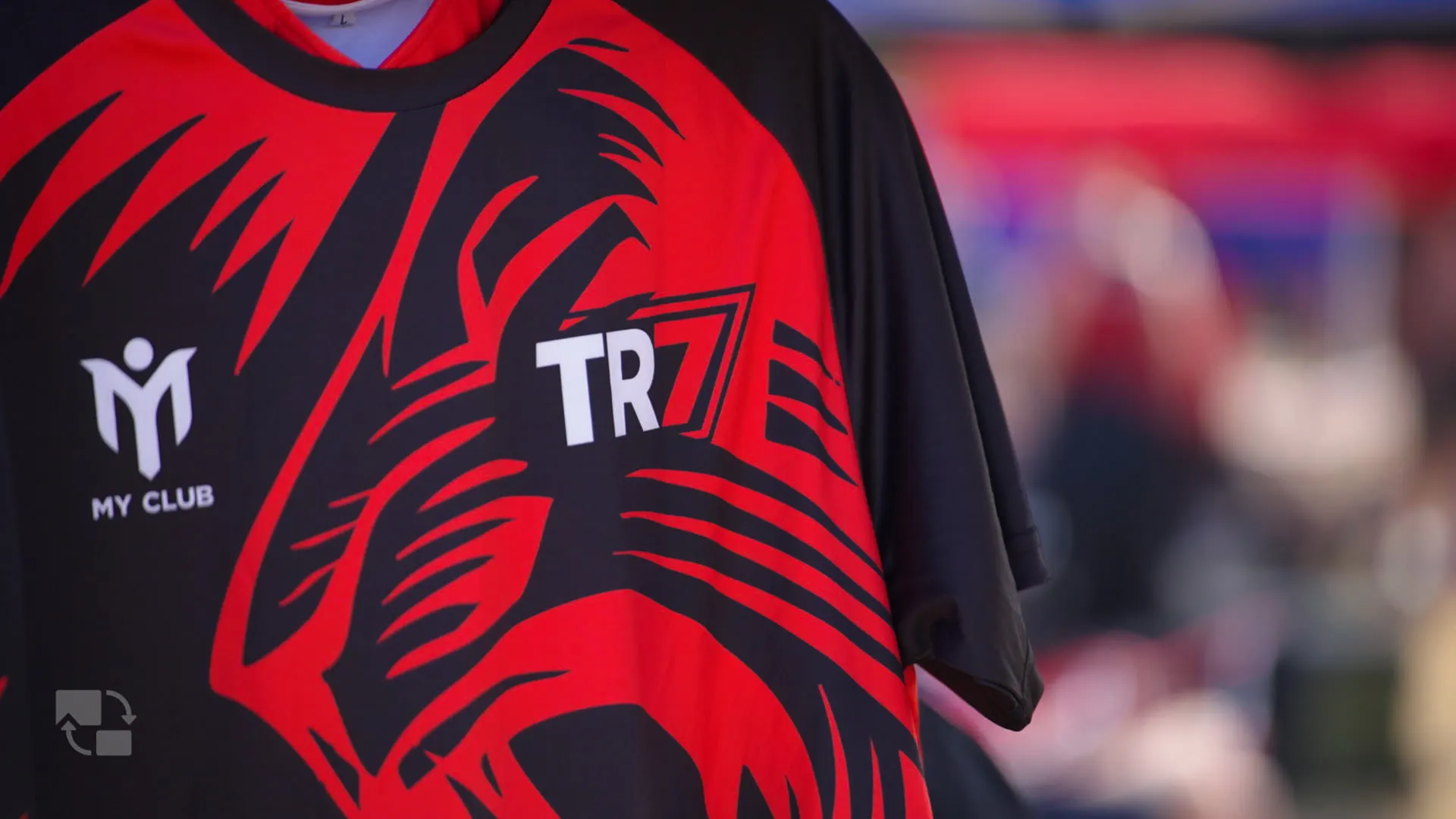 Close view of the red and black TR7 shirt at Hamplified
