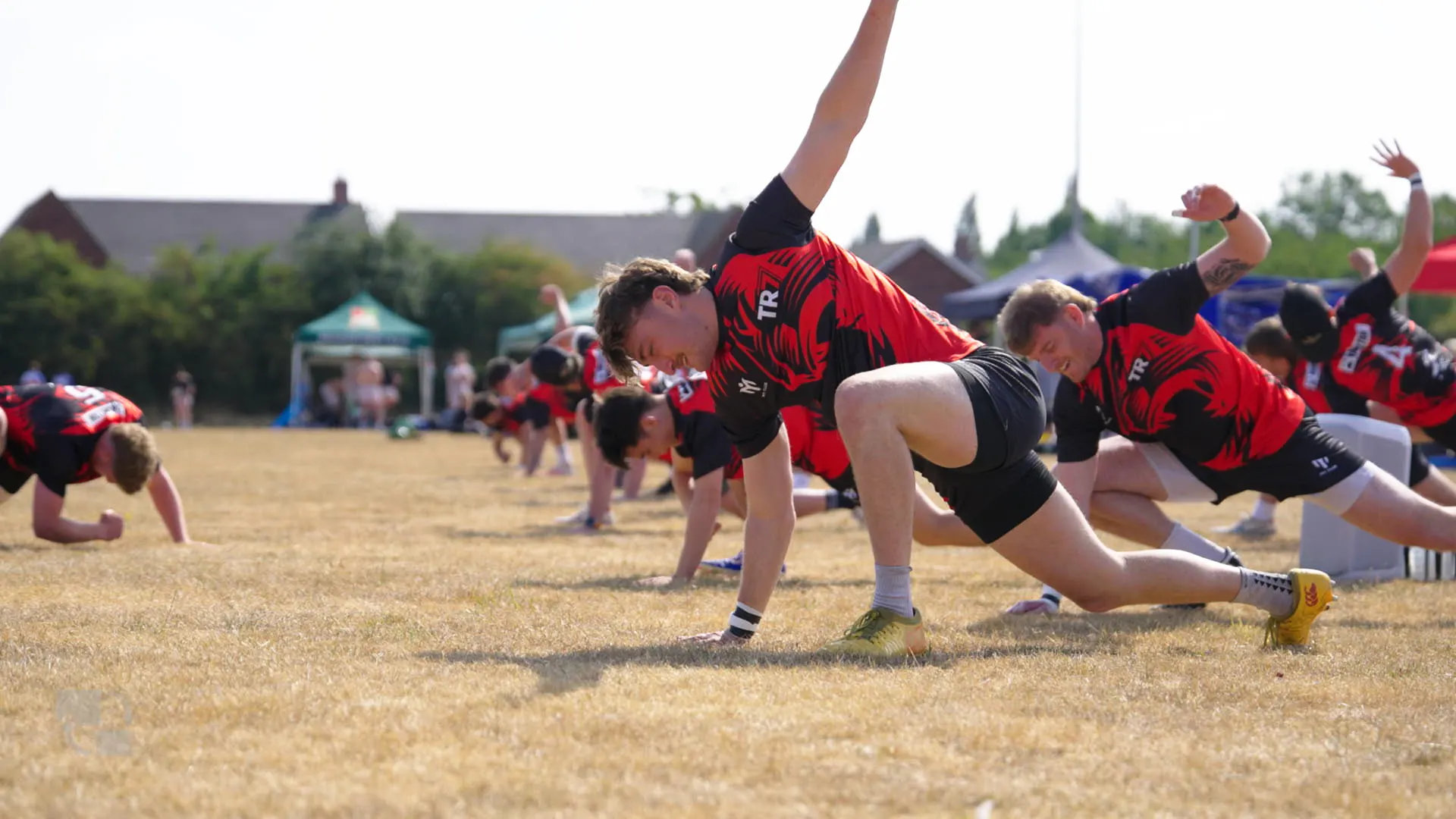 TR7 players stretching together before the Hamplified rugby matches